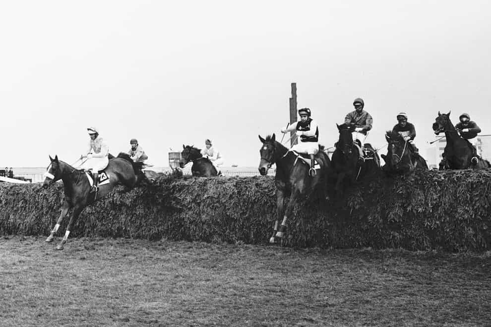 Over the Chair fence during the first circuit and Lucius (fourth from right and eventual winner) ridden by Bob Davies, is well placed amongst the leaders. Left (No 23) is Sebastian V (Radley Lamb up) finished second and Drumroan (third from right) with Gerry Newman in the saddle took third place (PA)