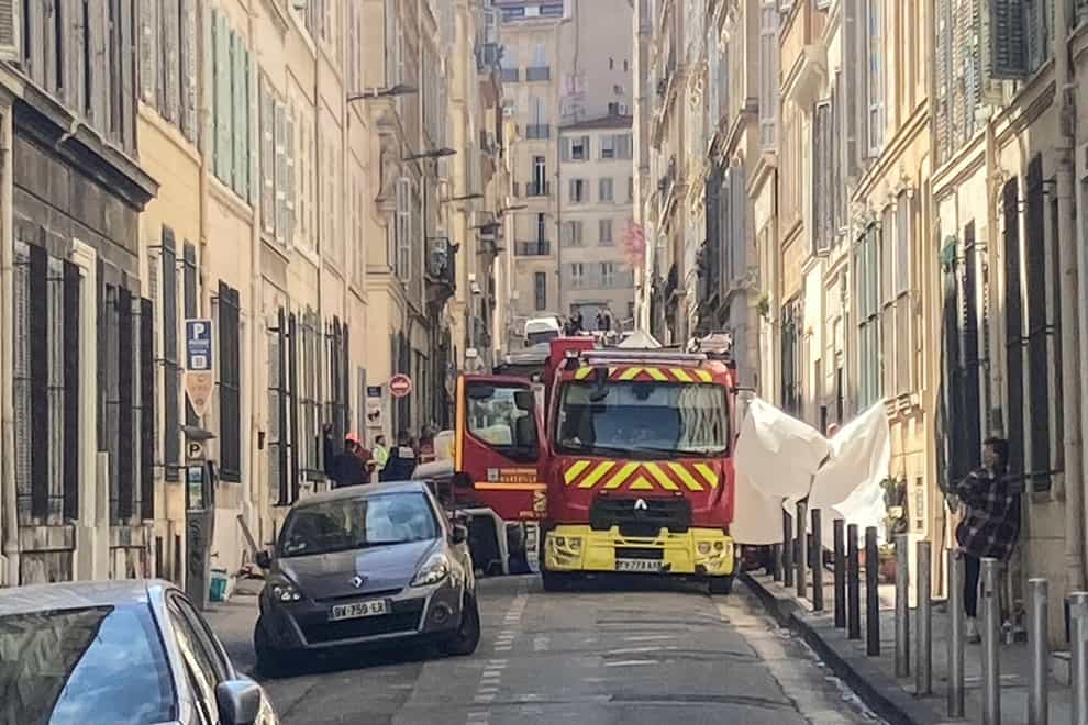 A fire engine is parked in a street near the scene where a building collapsed in Marseille (Bishr El Touni/AP)