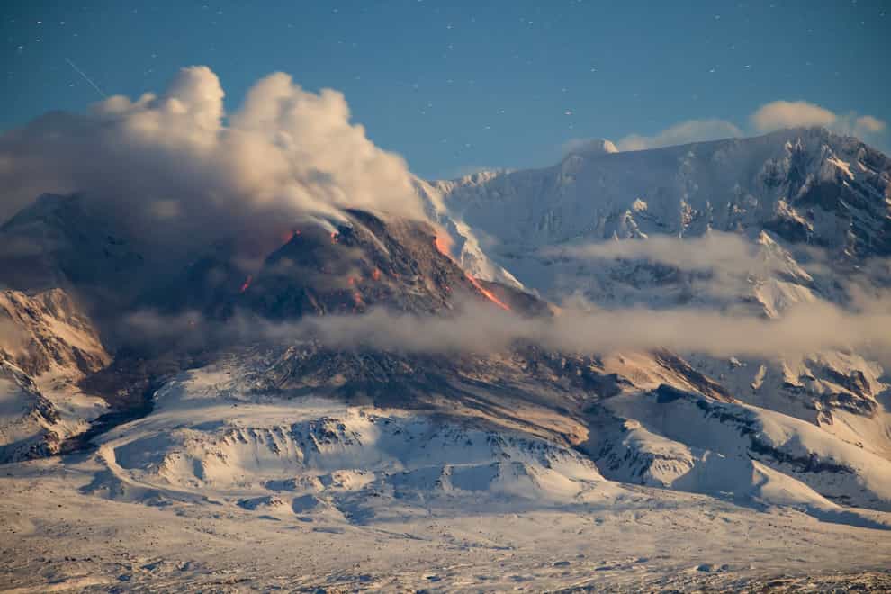Lava and steam are visible during the Shiveluch eruption (Yury Demyanchuk, The Russian Academy of Sciences’ Vulcanology Institute via AP)