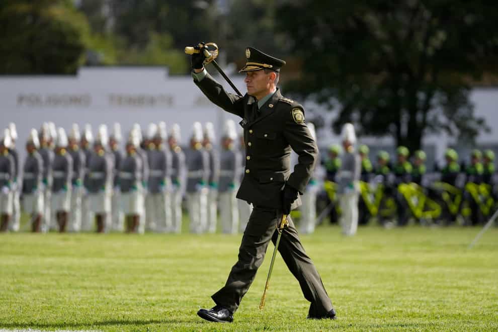 FILE – Colombian Police Chief Gen. Henry Sanabria parades during his swearing-in ceremony in Bogota, Colombia, Aug. 19, 2022. Colombian President Gustavo Petro on April 12, 2023 removed Sanabria as national police director who had talked about using exorcisms to catch fugitives. (AP Photo/Fernando Vergara, File)
