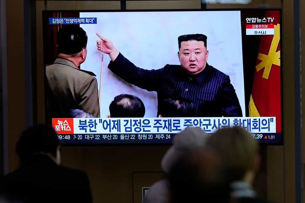 North Korea launched a ballistic missile toward the sea between the Korean peninsula and Japan on Thursday, prompting Japan to order residents on an island to take shelter as a precaution. A TV screen shows an image of North Korean leader Kim Jong Un, during a news program at the Seoul Railway Station in Seoul, South Korea. (Lee Jin-man, AP Photo)
