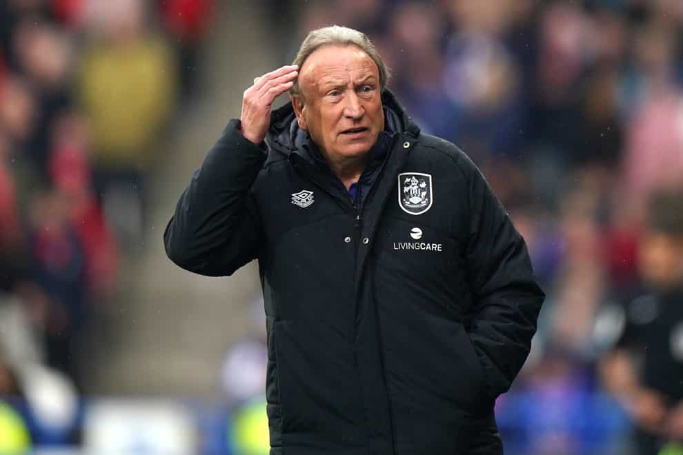 Huddersfield manager Neil Warnock saw his team lose at Swansea (Tim Goode/PA)