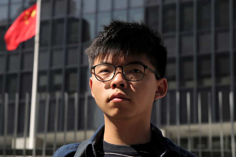 Hong Kong pro-democracy activist Joshua Wong has been sentenced to three months in prison for breaching court bans on disclosing personal information about a police officer during 2019 anti-government protests (Kin Cheung/AP)