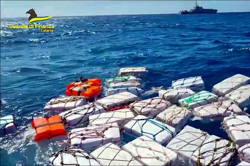 Italian police have scooped up two tons of cocaine, found wrapped in protective plastic and bobbing in the sea off eastern Sicily (Italian Financial Police/AP)