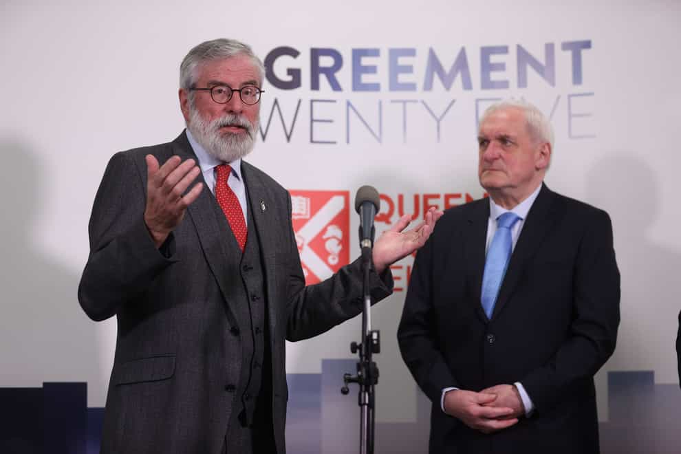 Former taoiseach Bertie Ahern (right) watches on as former Sinn Fein president Gerry Adams speaks to the media (Liam McBurney/PA)