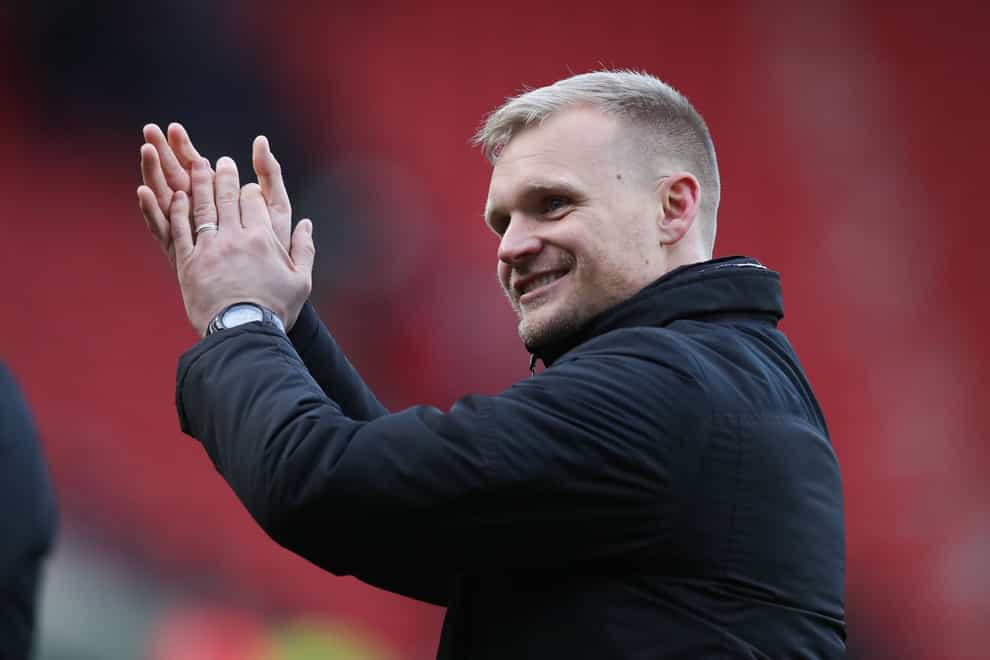 Milton Keynes Dons manager Liam Manning celebrates following the Sky Bet League One match at the AESSEAL New York Stadium, Rotherham. Picture date: Saturday March 5, 2022.