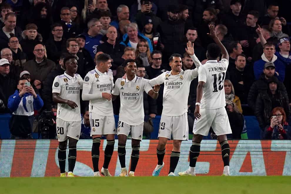 Real Madrid’s Rodrygo celebrates scoring their side’s second goal of the game with team-mates during the UEFA Champions League quarter-final second leg match at Stamford Bridge, London. Picture date: Tuesday April 18, 2023.