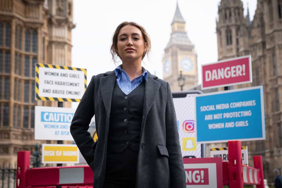 Georgia Harrison joined a demonstration organised by Refuge outside the Houses of Parliament (Stefan Rousseau/PA)