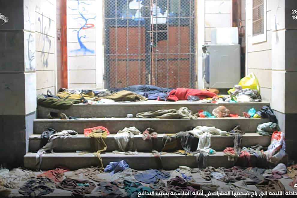 Clothes lie strewn on the ground in the aftermath of the stampede (Ansar Allah Houthi Media Office via AP)