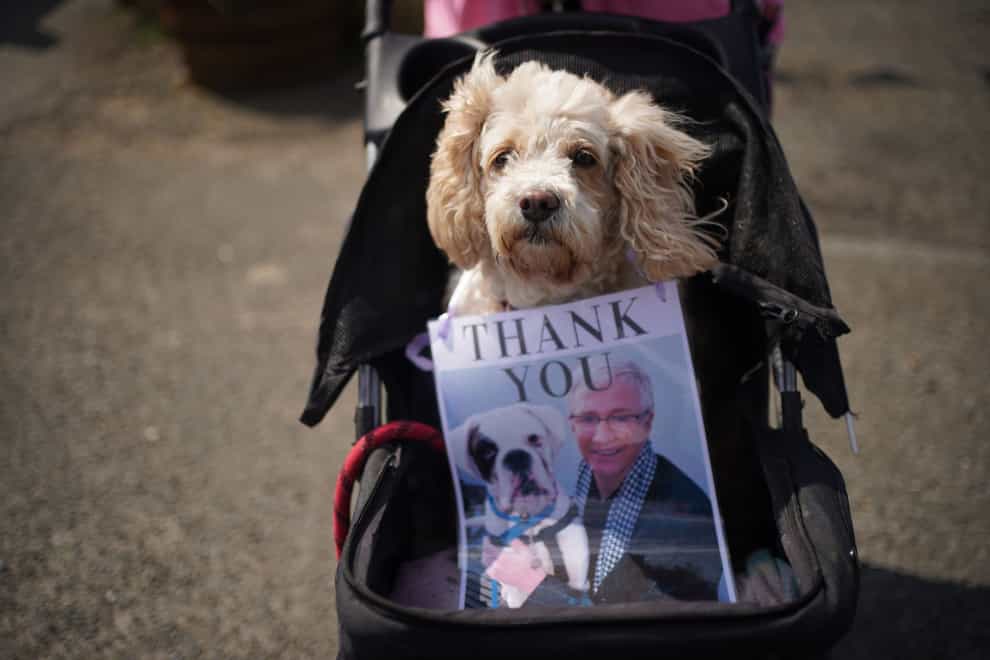 Battersea Dogs & Cats Home paid tribute to Paul O’Grady with a canine guard of honour at his funeral (Yui Mok/PA)