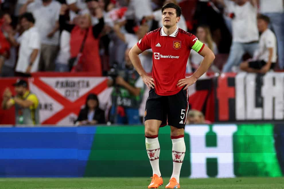 Harry Maguire looks dejected during the Europa League defeat to Sevilla (Isabel Infantes/PA)
