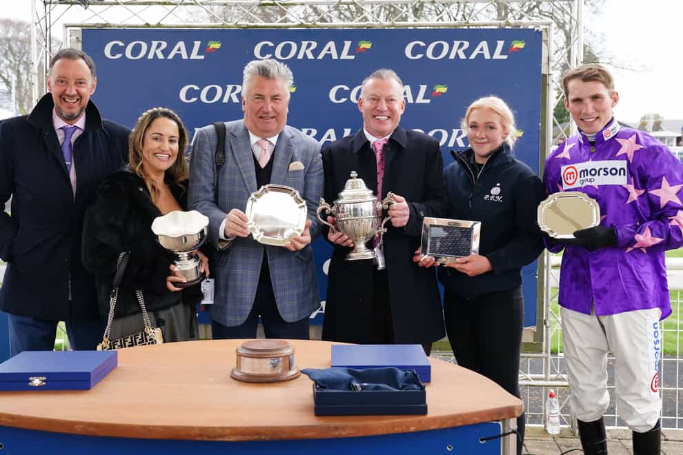 A presentation to the winning parties after Rubaud, ridden by jockey Harry Cobden (right) and trained by Paul Nicholls (third left), won the Coral Scottish Champion Hurdle during the Coral Scottish Grand National festival at Ayr Racecourse. Picture date: Saturday April 22, 2023.