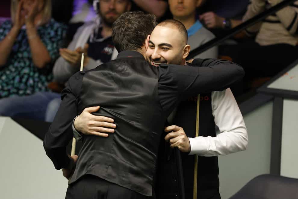 Ronnie O’Sullivan and Hossein Vafaei after their match during day eight of the Cazoo World Snooker Championship at the Crucible Theatre, Sheffield. Picture date: Saturday April 22, 2023.