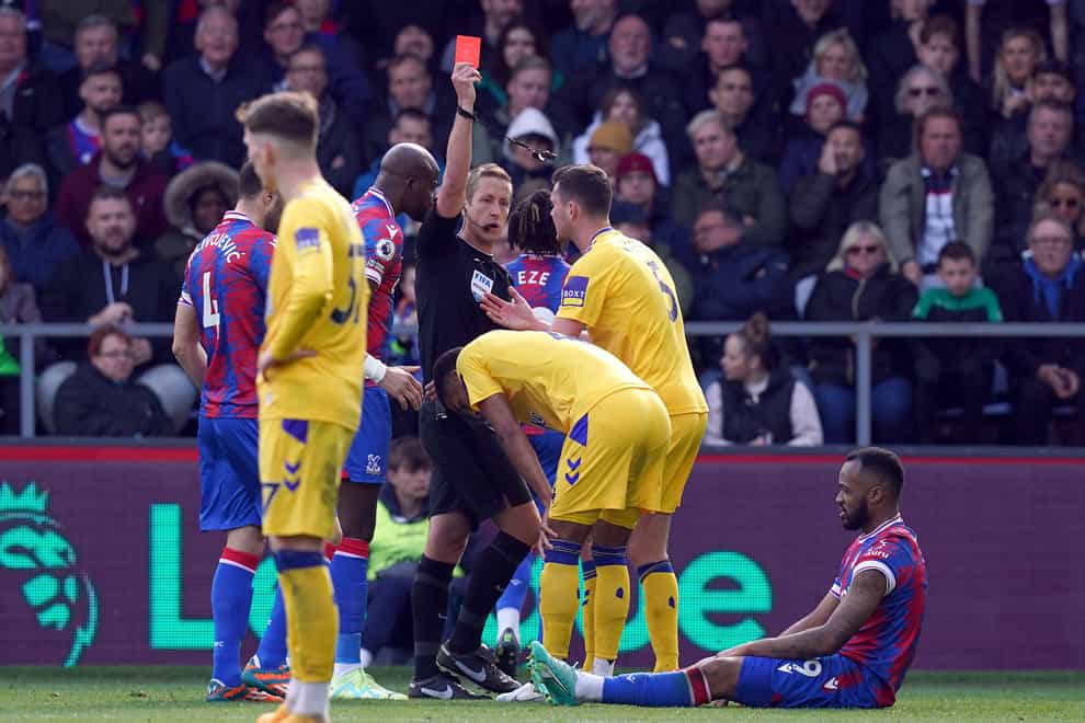 Referee John Brooks shows a red card to Everton’s Mason Holgate during the Premier League match at Selhurst Park, London. Picture date: Saturday April 22, 2023.