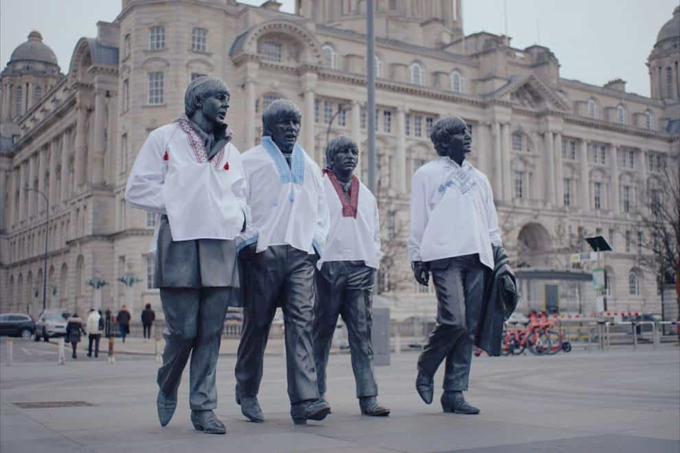 For use in UK, Ireland or Benelux countries only Undated BBC handout photo of the Beatles statue at Pier Head in Liverpool, which has been dressed in traditional Ukrainian clothing ahead of Eurovision (BBC Studios/PA)