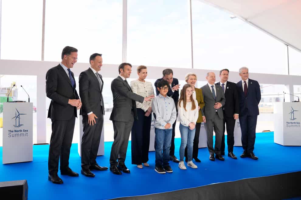 From left, Netherland’s Prime Minister Mark Rutte, Ireland’s Prime Minister Leo Varadkar, French President Emmanuel Macron, Denmark’s Prime Minister Mette Frederiksen, Belgium’s Prime Minister Alexander De Croo, European Commission president Ursula von der Leyen, Germany’s Chancellor Olaf Scholz, Luxembourg’s Prime Minister Xavier Bettel and Norway’s Prime Minister Jonas Gahr Store pose for photographers at the end of a media conference at the North Sea Summit in Ostend, Belgium (Virginia Mayo/AP)