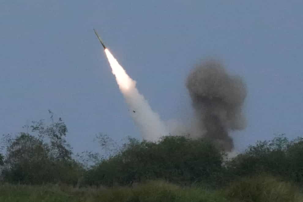 A US M142 High Mobility Artillery Rocket System fires a missile during the joint military exercise in northern Philippines (Aaron Favila/AP)
