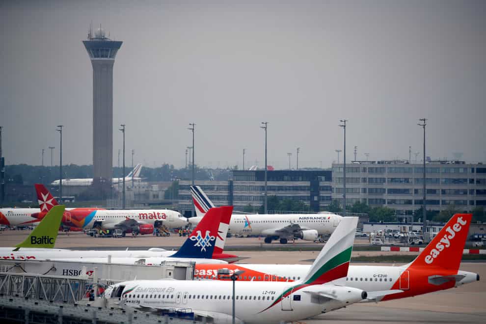 Planes parked on the tarmac at Paris Charles de Gaulle airport in France (Christophe Ena/AP)