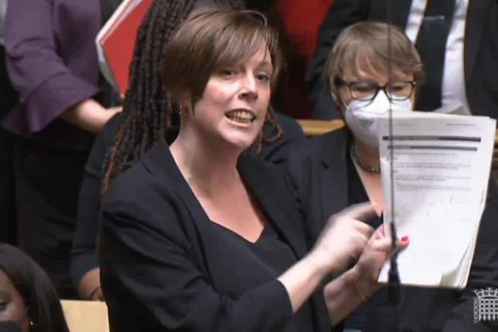 Jess Phillips MP holds the Sue Gray report up as she responds to a statement by Prime Minister Boris Johnson to MPs in the House of Commons on the Sue Gray report. Picture date: Monday January 31, 2022.