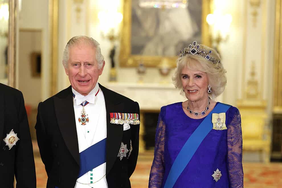 The King and the Queen Consort during a state banquet (PA)