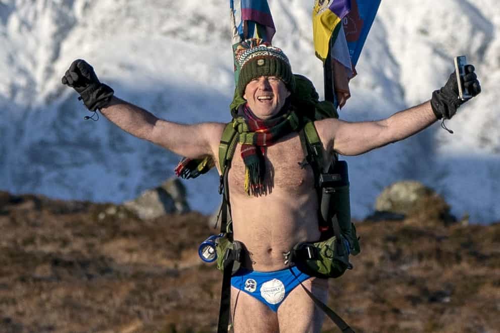 Mick Cullen, otherwise known as Speedo Mick, walks through Glencoe in sub-zero temperatures wearing only his swimming trunks. Mick is walking 1,000 miles from John O’Groats to Land’s End whilst also completing the Three-Peak Challenge to scale Ben Nevis, Scafell Pike and Mount Snowdon along the way (Jane Barlow/PA Wire)