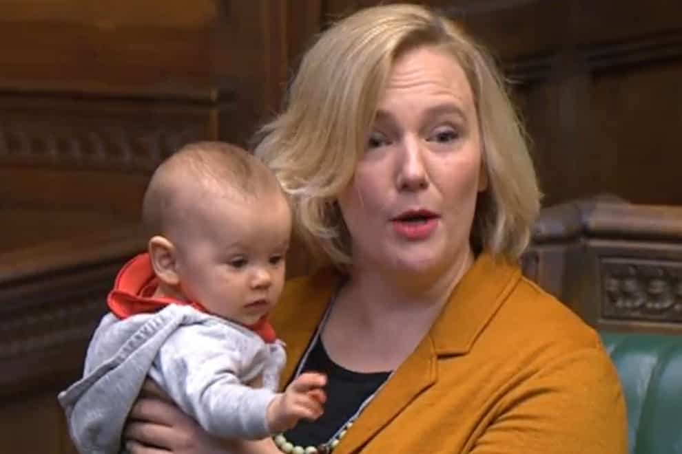 Labour MP Stella Creasy holds her daughter in the House of Commons (House of Commons/PA)
