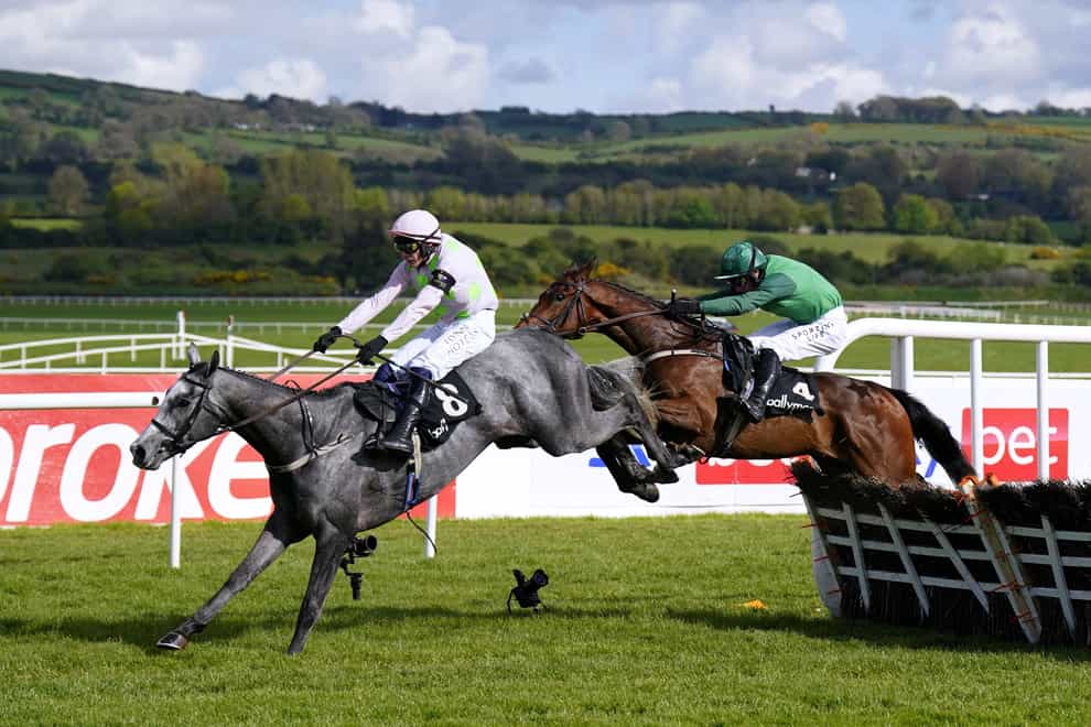 Lossiemouth ridden by jockey Paul Townend (left) jumps the last on their way to winning the Ballymore Champion Four Year Old Hurdle during day five of the Punchestown Festival at Punchestown Racecourse in County Kildare, Ireland (Niall Carson/PA)