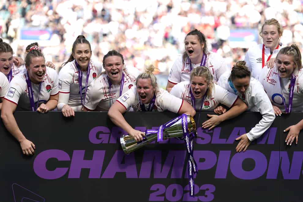 England captain Marlie Packer (centre) celebrates with the women’s Six Nations trophy after the 38-33 win over France at Twickenham (Andrew Matthews/PA Images).
