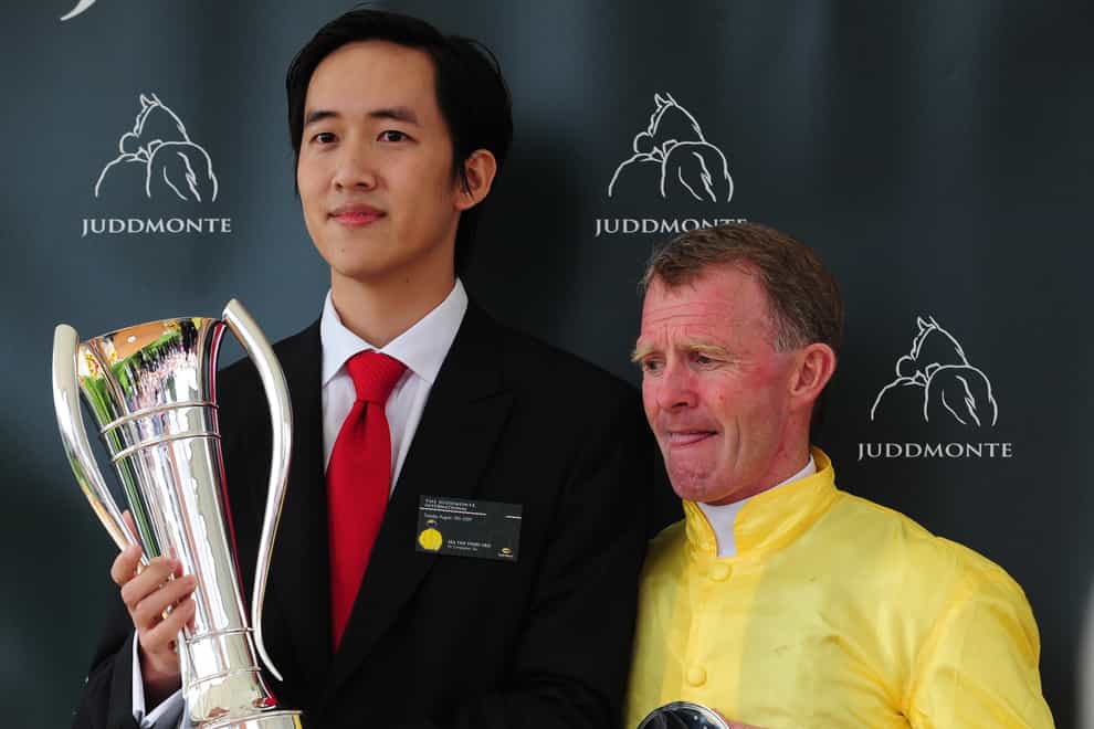 Jockey Mick Kinane (right) with his trophy after victory on Sea The Stars in the Juddmonte International Stakes during the Juddmonte International Day in the ebor Festival at York Racecourse.