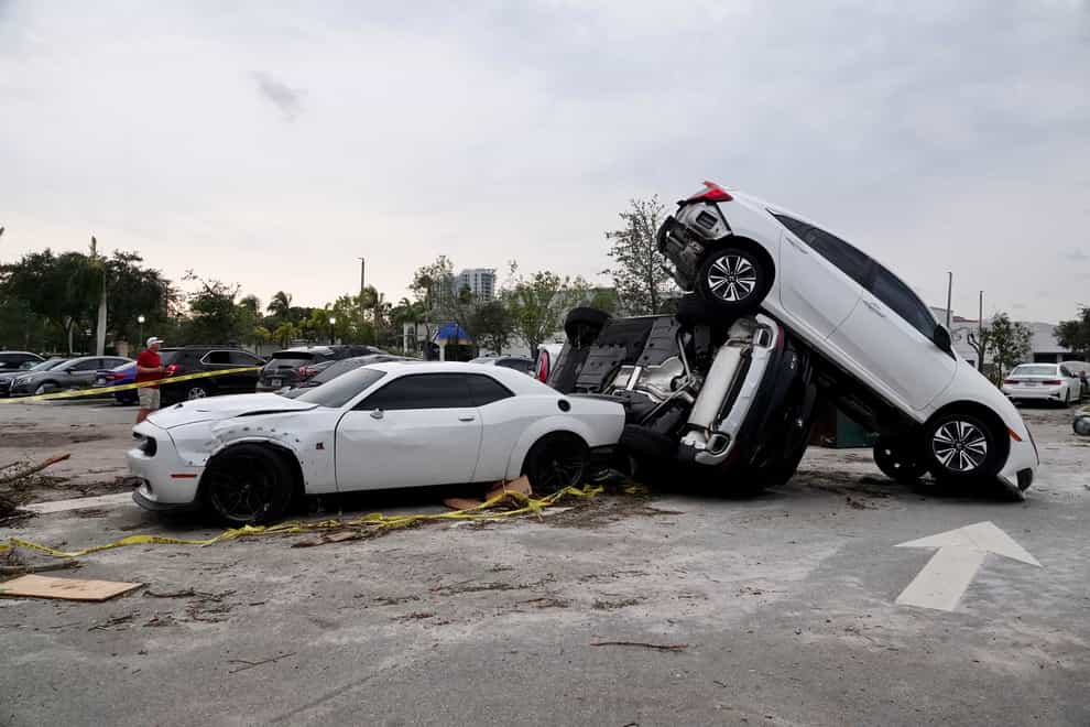 Damaged cars after a reported tornado hit the area in Palm Beach Gardens, Florida (Joe Cavaretta/South Florida Sun-Sentinel via AP)