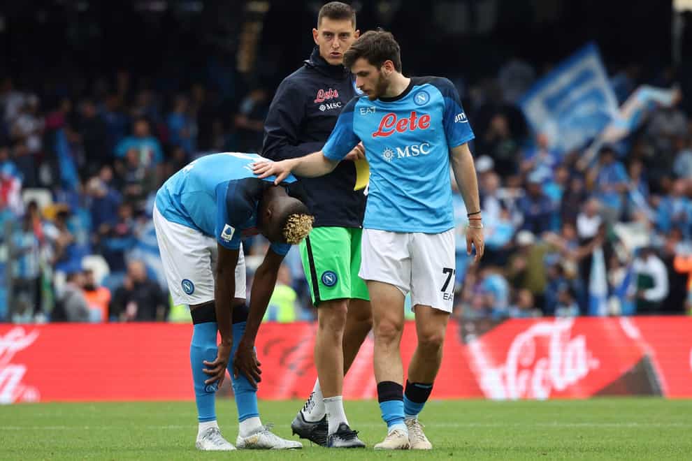 Napoli’s Victor Osimhen (left) is consoled by Khvicha Kvaratskhelia after a 1-1 draw with Salernitana was not enough to seal the Serie A title (Alessandro Garofalo/LaPresse via AP)