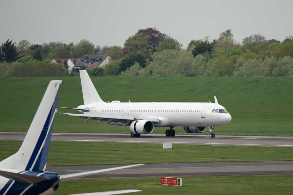 The plane with people evacuated from Sudan from Cyprus touches down at Birmingham airport. (Joe Giddens/PA)