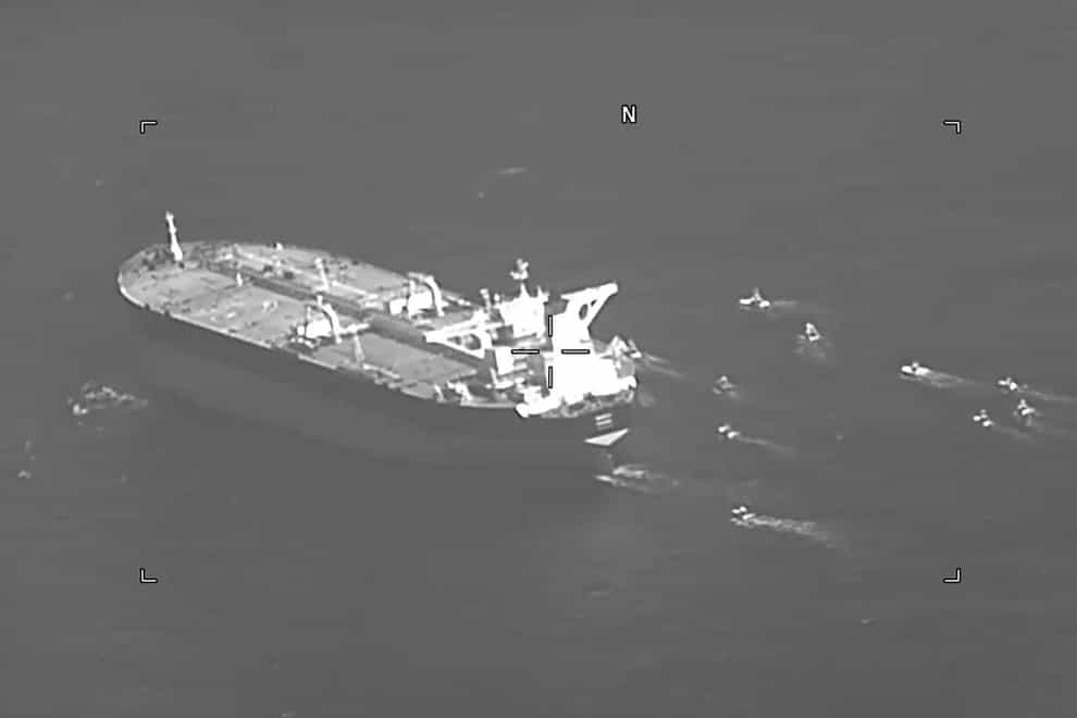 The Panama-flagged oil tanker Niovi surrounded by Iranian Revolutionary Guard vessels in the Strait of Hormuz (US Navy via AP)