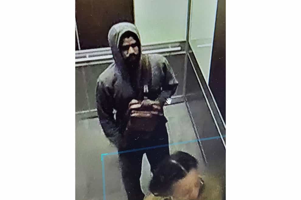 This photo released by the Atlanta Police Department of video footage on Wednesday, May 3, 2023, shows a suspected shooter. Police said Wednesday afternoon that they were investigating an “active shooter situation” in a building in Atlanta’s Midtown neighborhood and that multiple people had been injured. (Atlanta Police Department via AP)