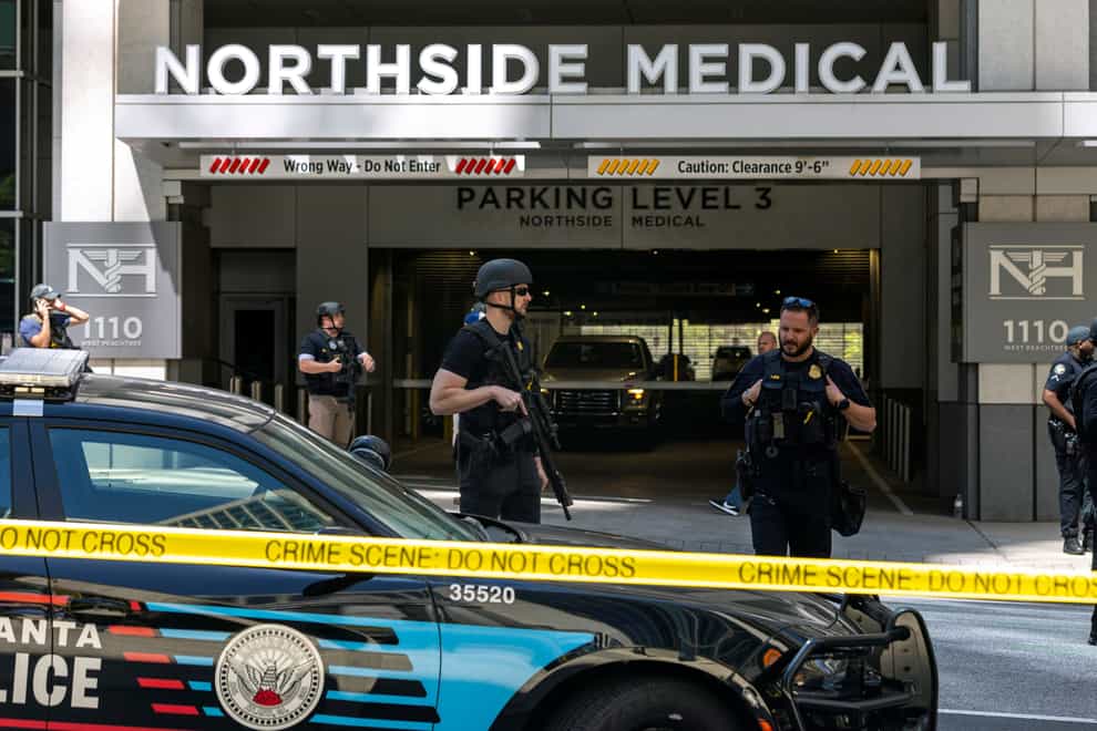 Police on Wednesday evening arrested a man accused of opening fire inside the waiting room of an Atlanta medical practice, killing one woman and wounding four others earlier in the day. (Arvin Temkar/Atlanta Journal-Constitution via AP)