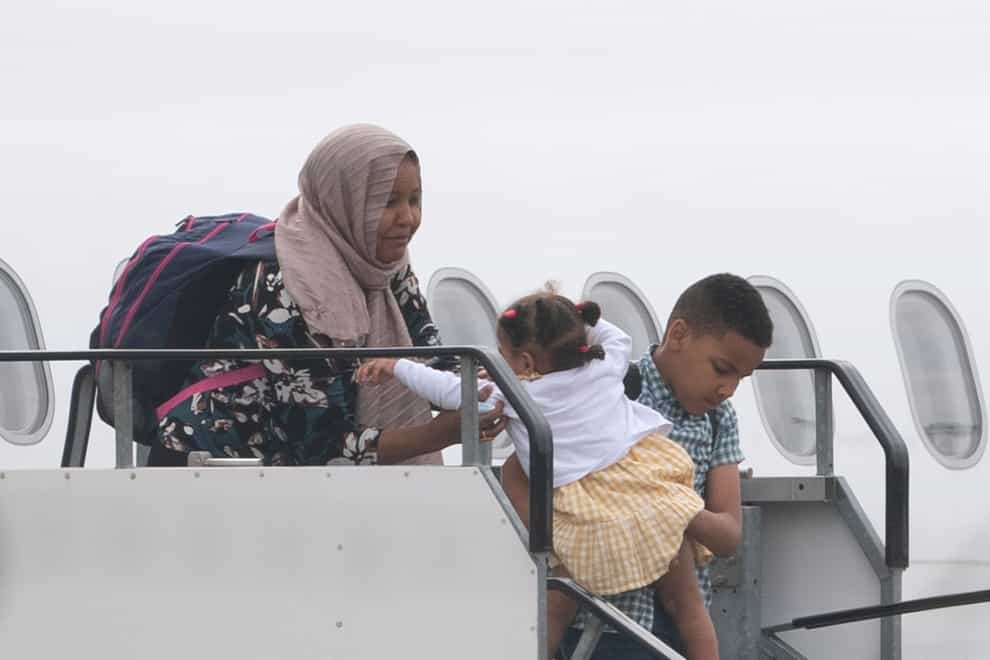 People evacuated from Sudan arrive on a flight from Cyprus into Birmingham airport on Tuesday (Joe Giddens/PA)