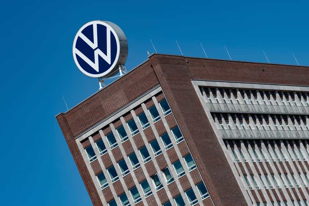 Volkswagen has reported a fall in profits (Swen Pfoertner/dpa via AP)