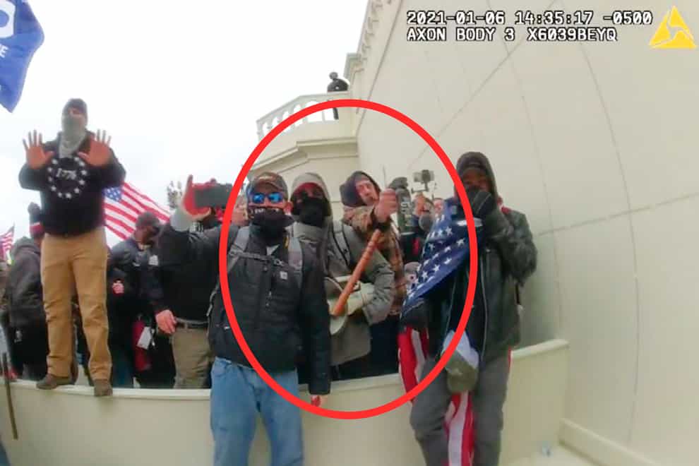 An image from a Washington Metropolitan Police Department officer’s body-worn video camera, released and annotated by the Justice Department in the Government’s Sentencing Memorandum, shows Peter Schwartz circled in red using a canister of pepper spray against officers on January 6, 2021, in Washington (Justice Department via AP/PA)