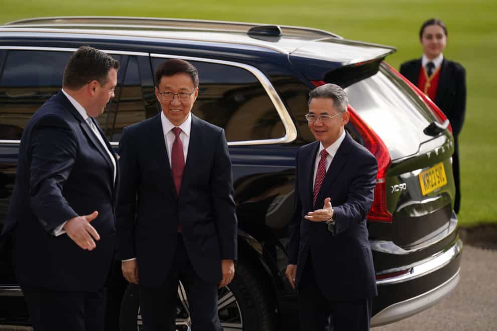 Vice-president of the People’s Republic of China, Han Zheng (centre), arrives for a reception at Buckingham Palace (PA)