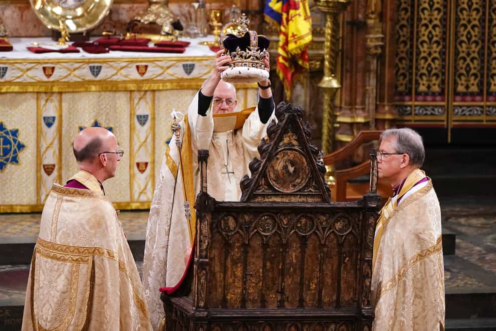 The King is crowned with St Edward’s Crown by The Archbishop of Canterbury the Most Reverend Justin Welby during his coronation ceremony in Westminster Abbey (Yui Mok/PA)
