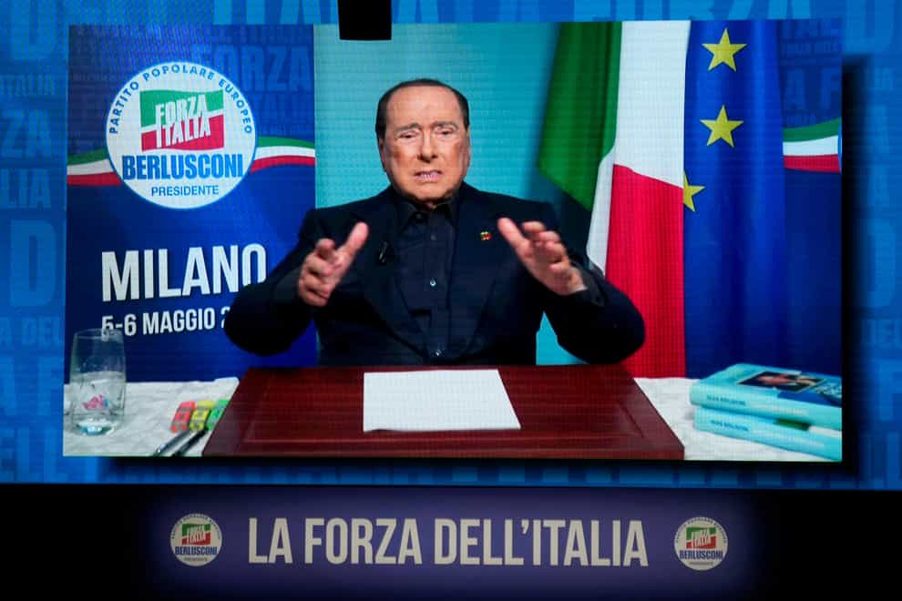 Silvio Berlusconi gestures as he talks in his video address during a Forza Italia party convention, in Milan, Italy, Saturday, May 6, 2023. (AP Photo/Luca Bruno)