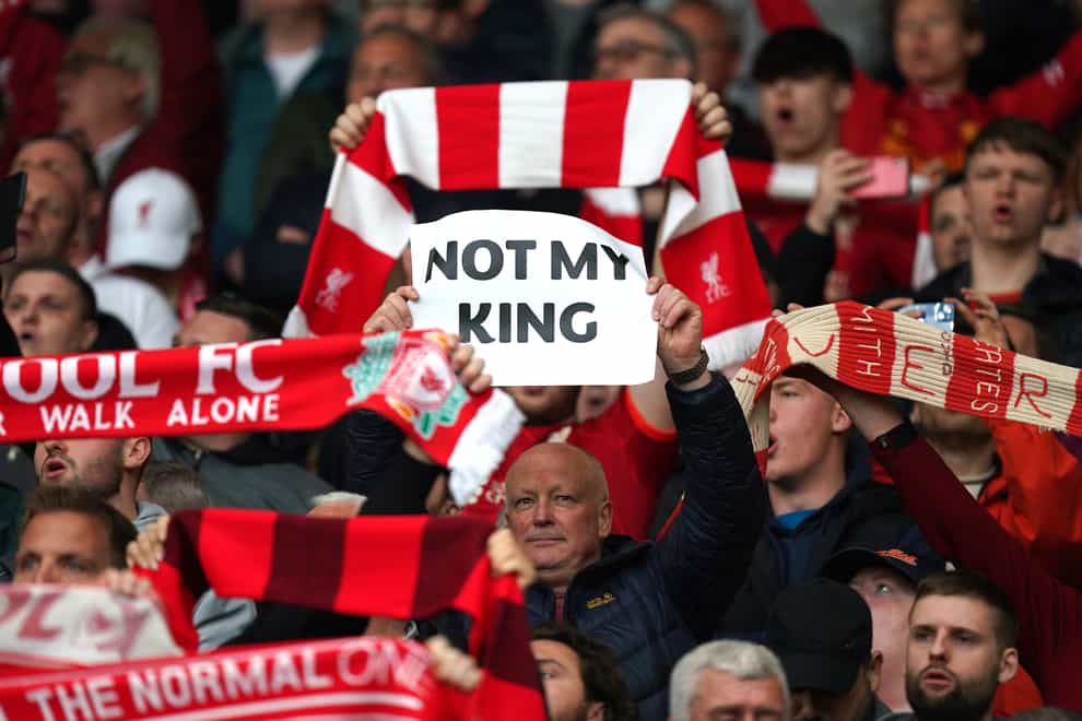 Liverpool fans hold up a sign before the Premier League match at Anfield (Mike Egerton/PA Wire)
