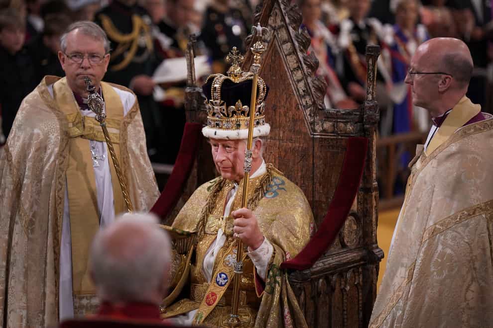 The King is crowned with St Edward’s Crown during his coronation ceremony (Victoria Jones/PA)