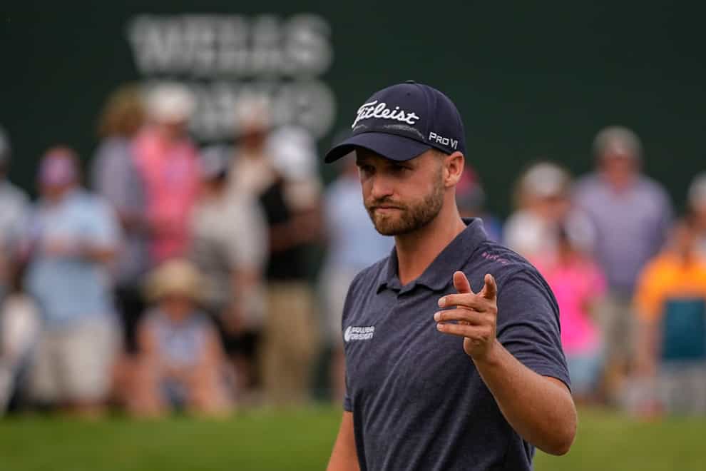 Wyndham Clark celebrates his victory in the Wells Fargo Championship at Quail Hollow (Chris Carlson/AP)