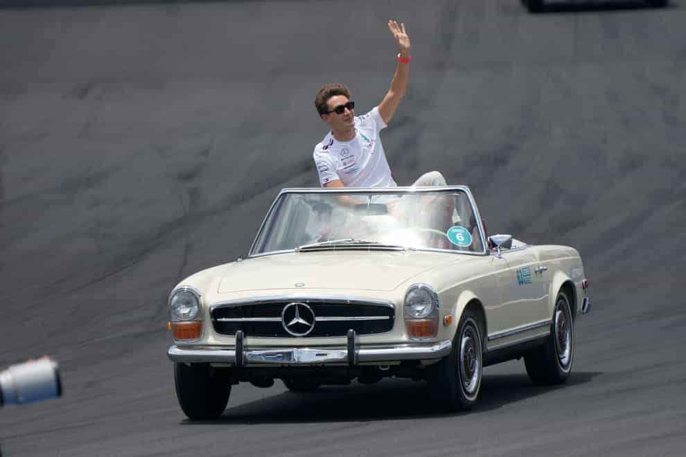 George Russell waves to the crowd during the drivers parade before during the Formula One Miami Grand Prix (Wilfredo Lee/AP)