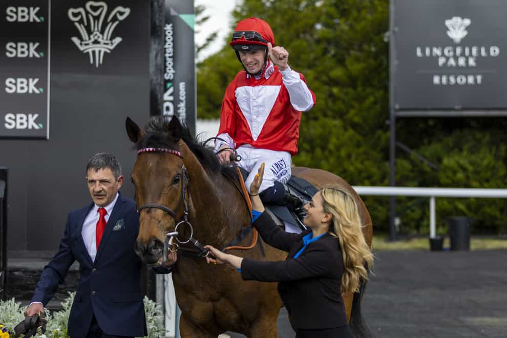Jockey Jack Mitchell in the winners enclosure after winning the SBK Oaks Trial Fillies’ Stakes aboard Rogue Millennium at Lingfield Park Racecourse. Picture date: Saturday May 7, 2022. (Steven Paston/PA)
