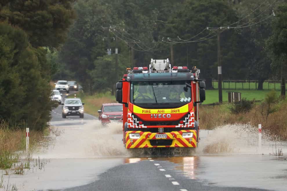 New Zealand police said they have found the body of a high school student in a cave after a school group got into trouble when floodwaters hit. A fire truck ploughs through water in Waimate, north of Auckland, New Zealand, Tuesday, May 9, 2023. Authorities in Auckland have declared a state of emergency as flooding again hits New Zealand’s largest city. (Peter de Graaf/Northern Advocate via AP)