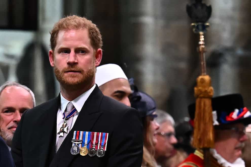 The Duke of Sussex looks on as the King leaves Westminster Abbey after the coronation ceremony (Ben Stansall/PA)