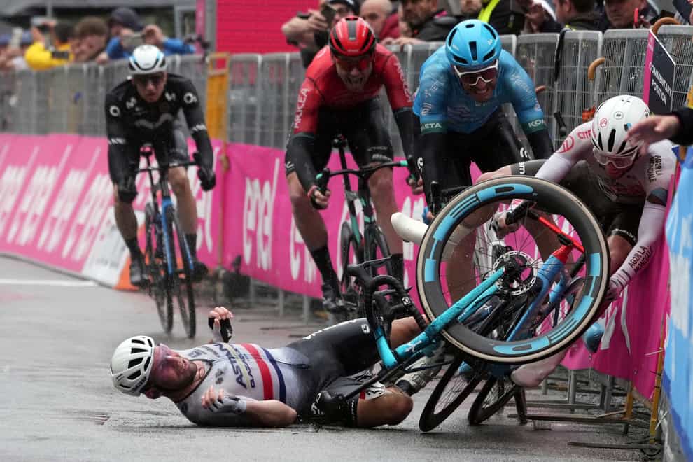 Mark Cavendish took fifth place despite crossing the line on his backside after a late crash (Gian Matthia D’Alberto/AP)