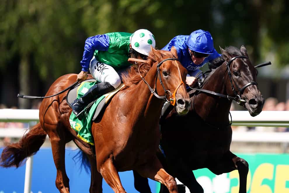 Isaac Shelby ridden by jockey Sean Levey (left) on their way to winning the bet365 Superlative Stakes ahead of Victory Dance and William Buick (right) on Darley July Cup Day of the Moet and Chandon July Festival at Newmarket racecourse, Suffolk. Picture date: Saturday July 9, 2022. (Mike Egerton/PA)
